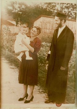 Chaim Yitzchok and Chayele with their firstborn child, autumn 1940; note white armband on sleeve 