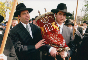 Baruch and son Yehuda holding Sefer Torah dedicated to Hindy Cohen