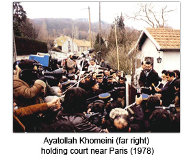 Ayatollah Khomeini (far right) holding court near Paris (1978)
