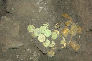 The recent unearthing of the largest cache of gold coins ever discovered in Jerusalem, comprising 264 coins that date back to the end of the Byzantine period in the 7th century CE. Credit: City of David Foundation.