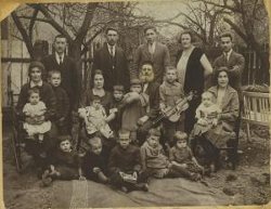 The Kurzweil family in Dobromil, Poland (ca. 1925). Fourteen out of the twenty-one people in the photo were murdered during the Holocaust. 