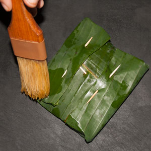 Brush all the leaf packages lightly with vegetable oil.