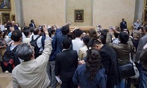 You made it to the Louvre, You're standing before the Mona Lisa. Why would you want to ruin the experience by yanking out a camera and clicking, instead of focusing on the masterpiece you've come to see?
