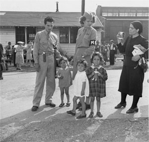 American military police help three little girls find their parents at the Fort Oswego Refugee Center. (Photo courtesy USHMM)