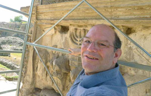 Dr. Fine on a scaffold, examining the Arch of Titus up close