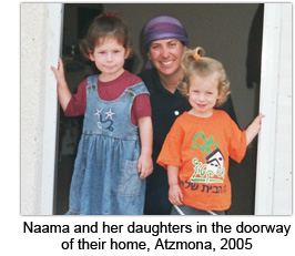 Naama and her daughters in the doorway of their home, Atzmona, 2005