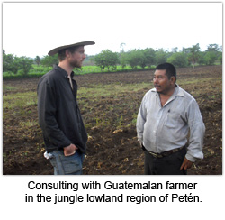 Consulting with a Guatemalan farmer in the jungle lowland region of Peten